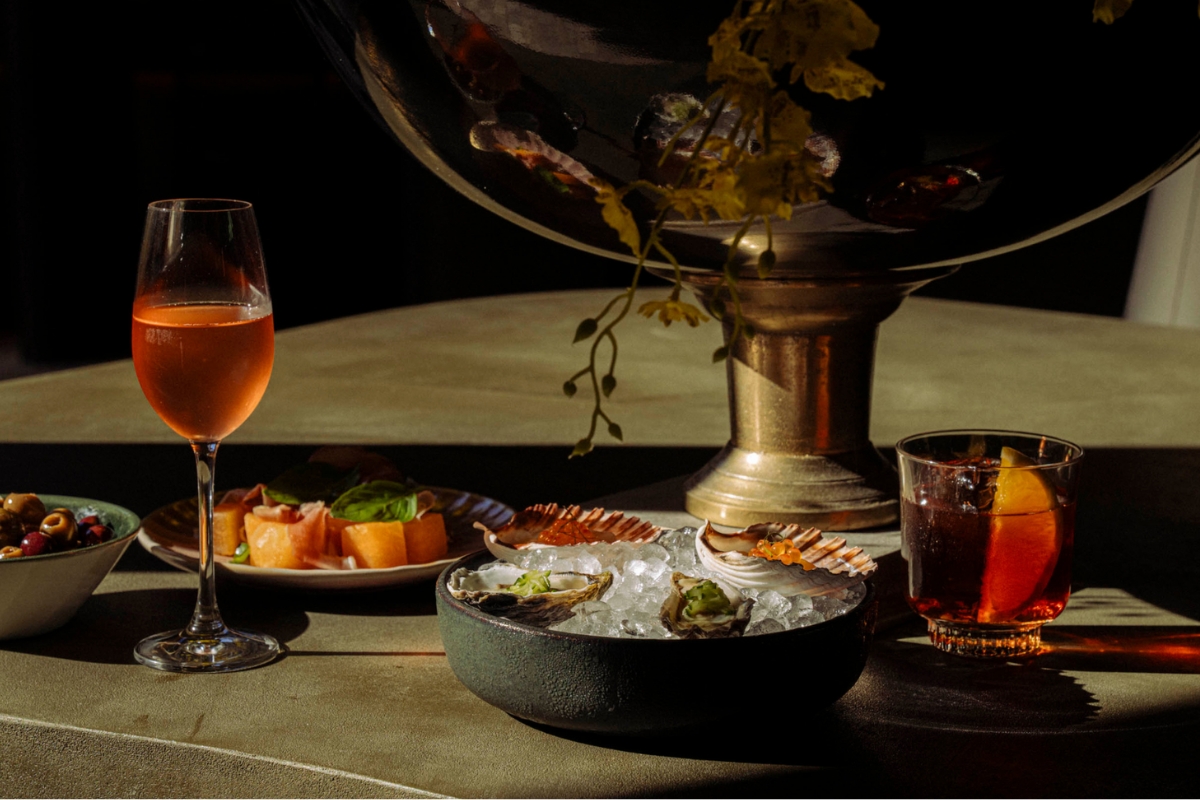 a plate of food and a glass of wine