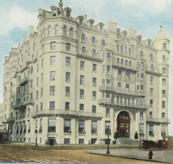 a large white building with a round tower