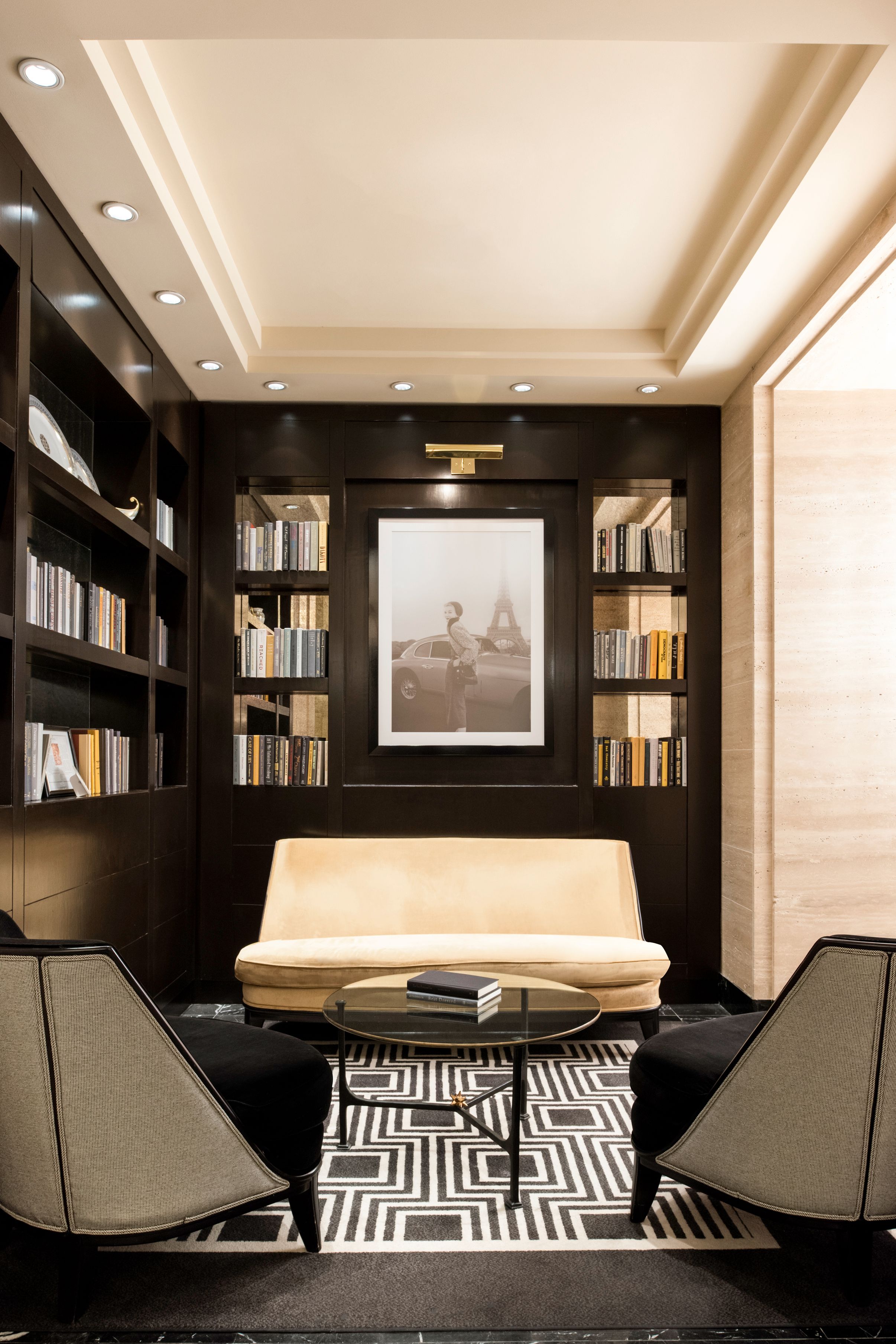 a room with a couch and bookshelves