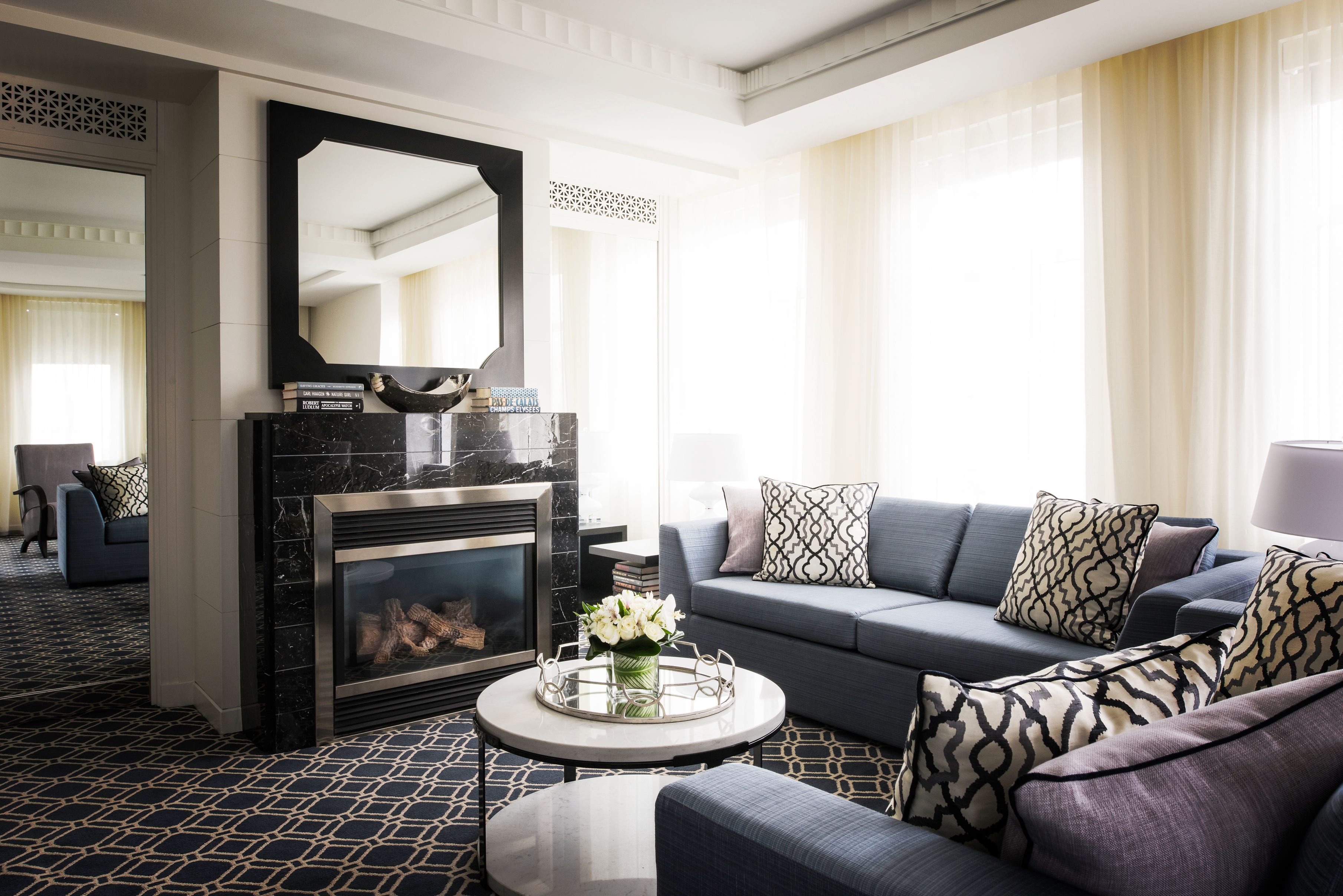 a living room with a fireplace and couch