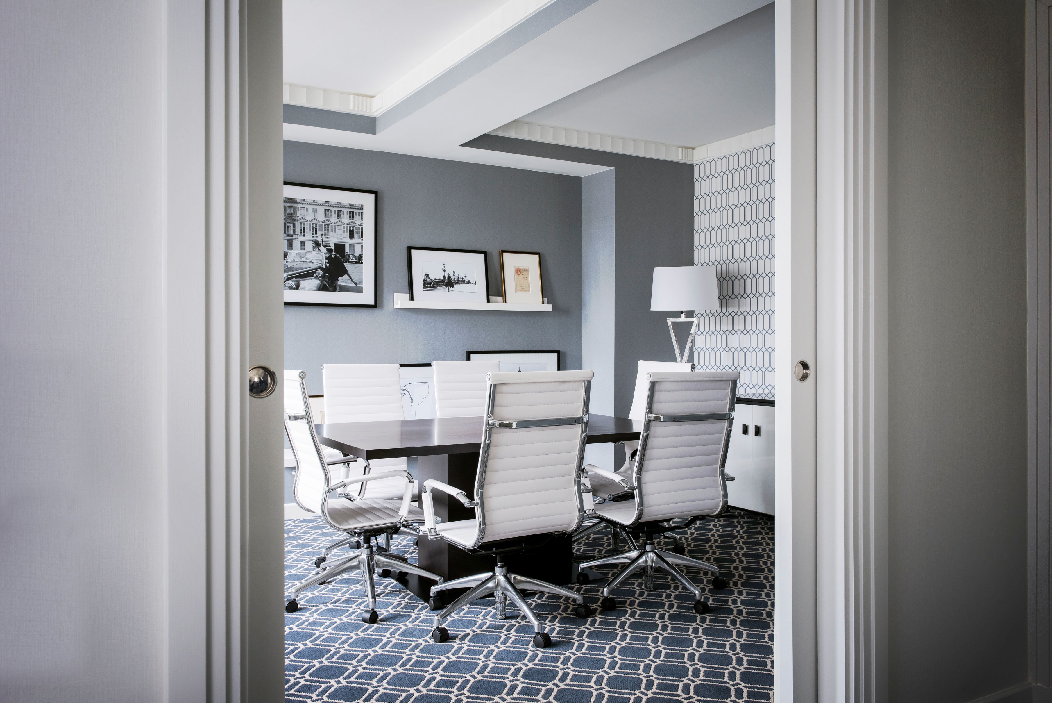 a room with a table and chairs