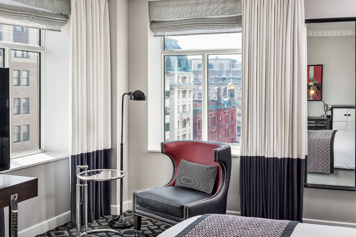 a room with a bed and a chair