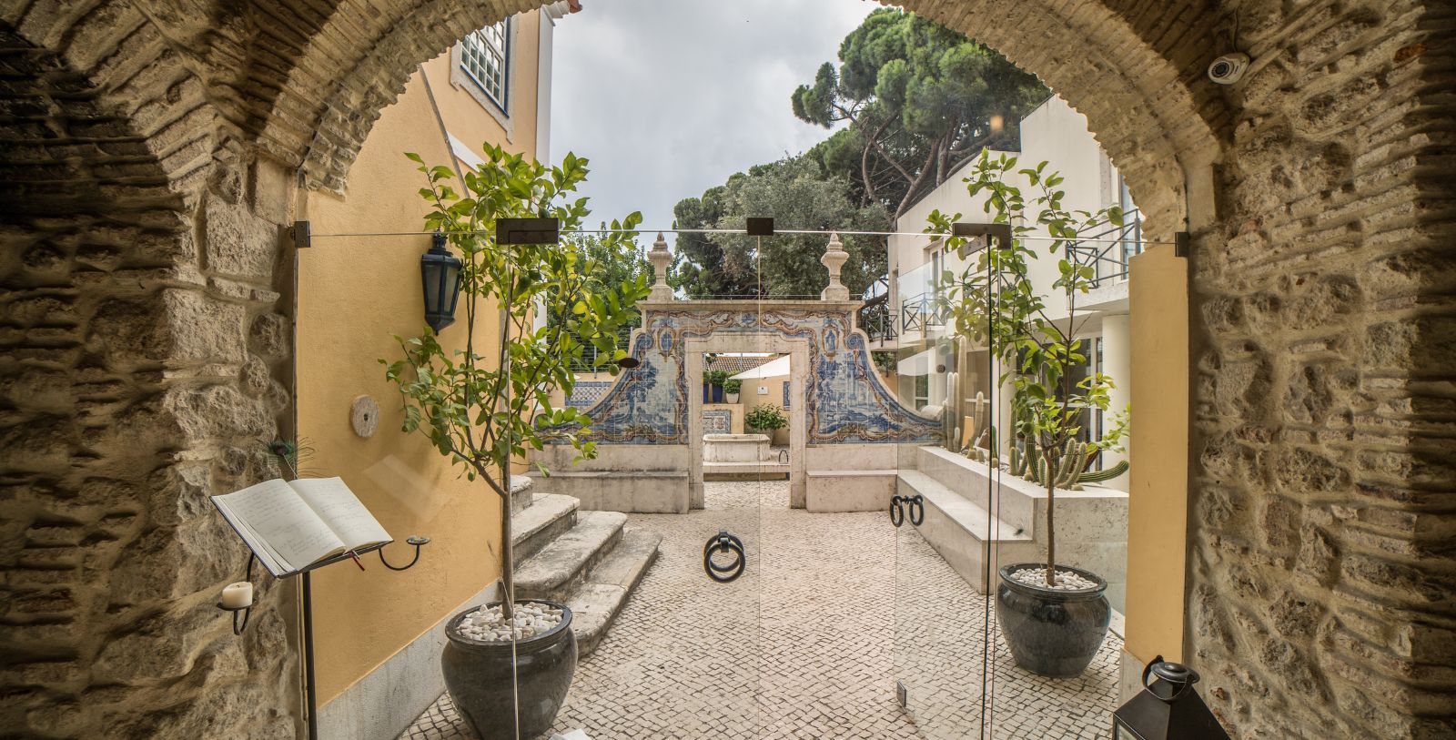 a courtyard with a glass door