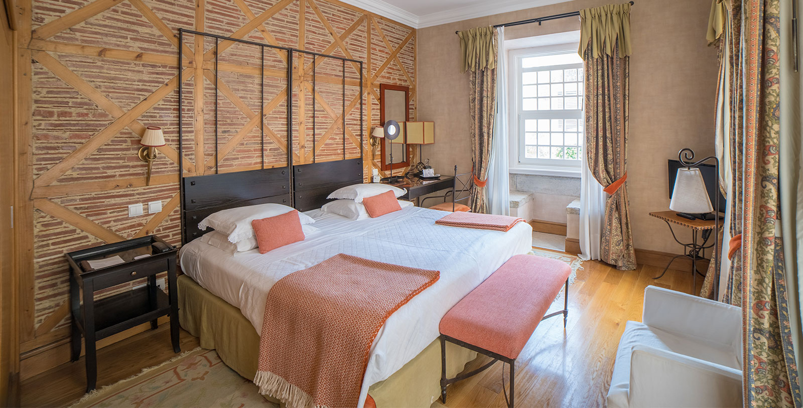 a bedroom with a bed and a bench