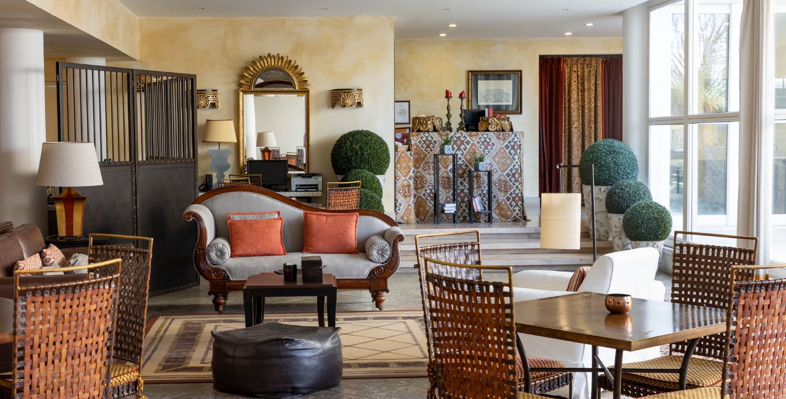 a living room with a couch and chairs