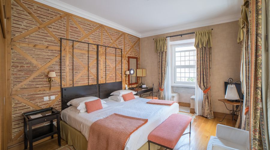 a room with a bed and a mirror