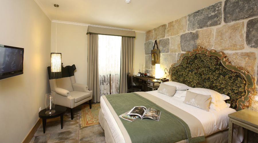 a room with a bed and chair