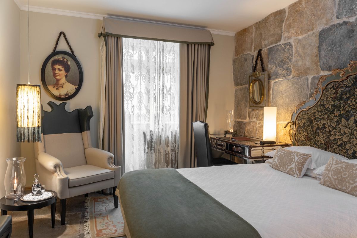 a bedroom with a bed and chair