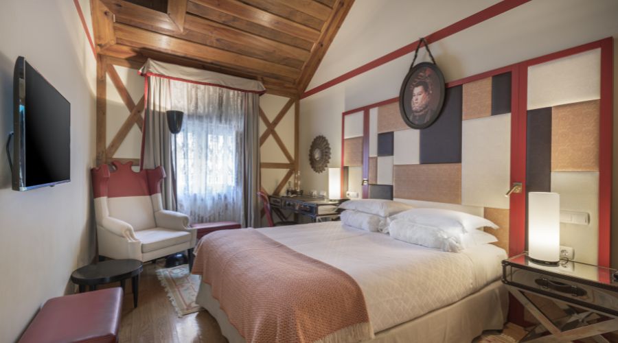 a bedroom with a bed and a chair