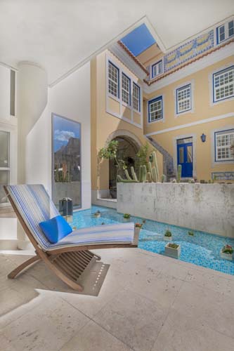 a chair next to a pool