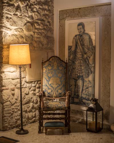 a chair next to a lamp