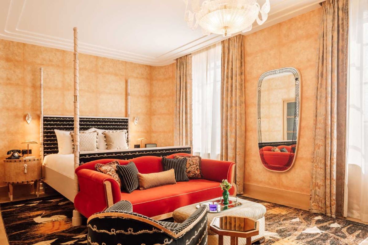 a room with a bed and a mirror