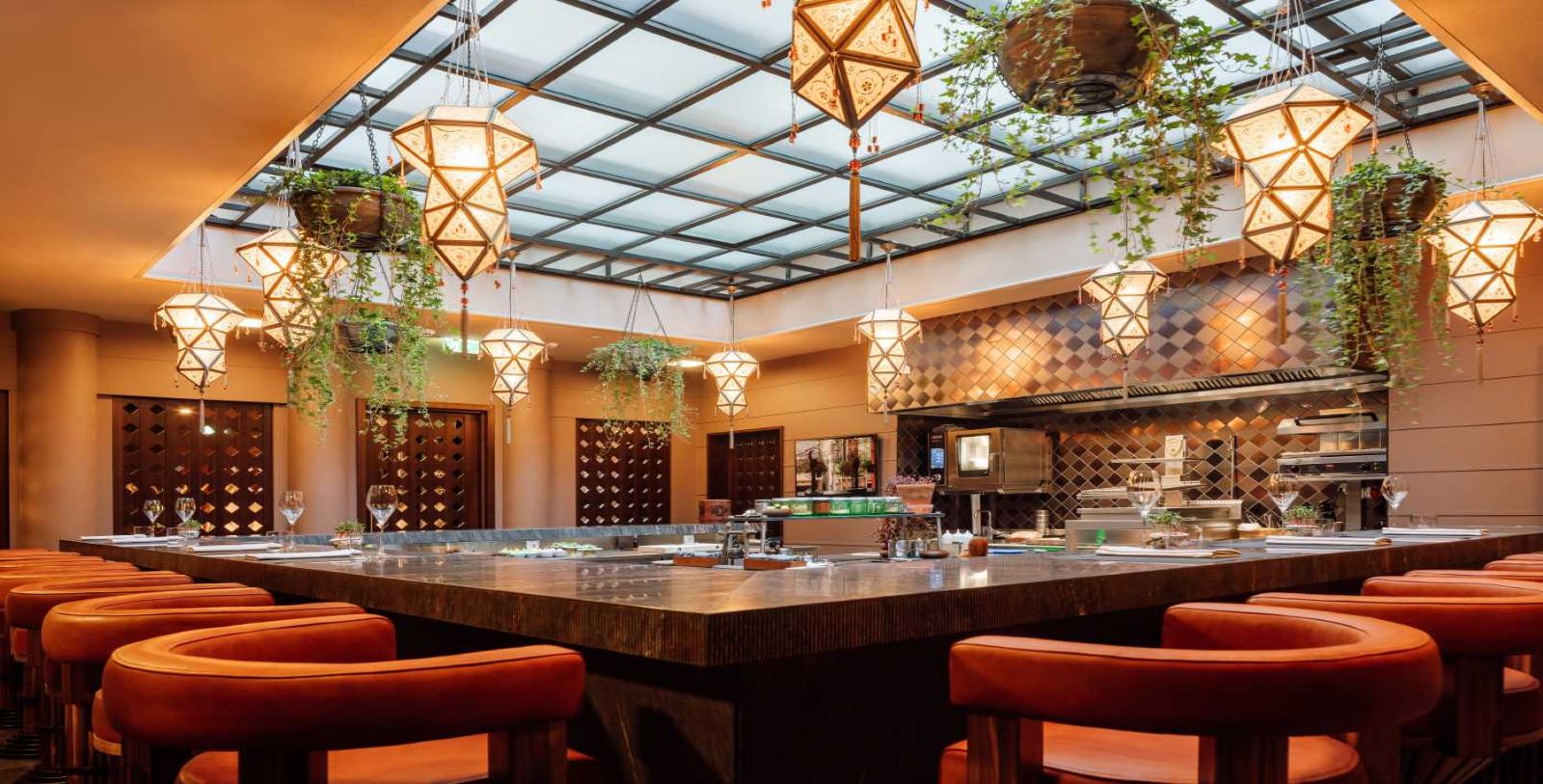 a large table with chairs and a glass ceiling
