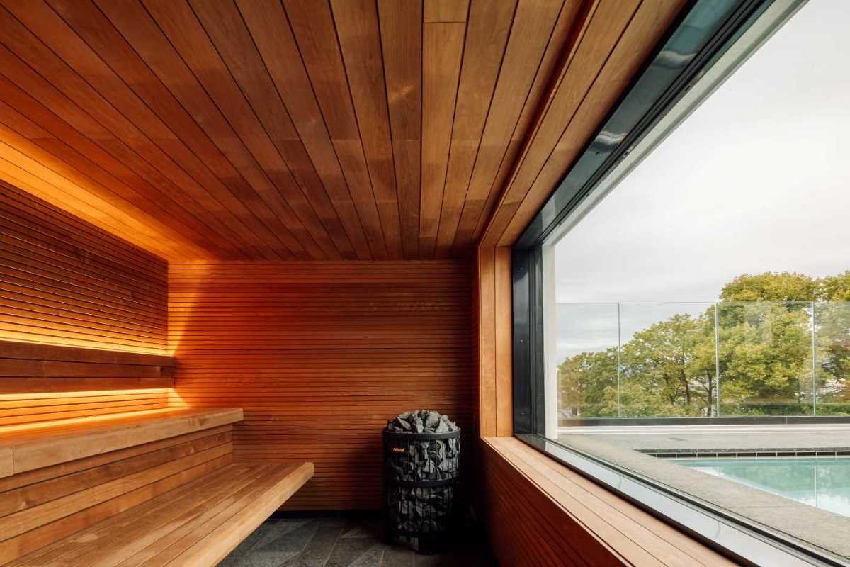 a wooden sauna with a large window