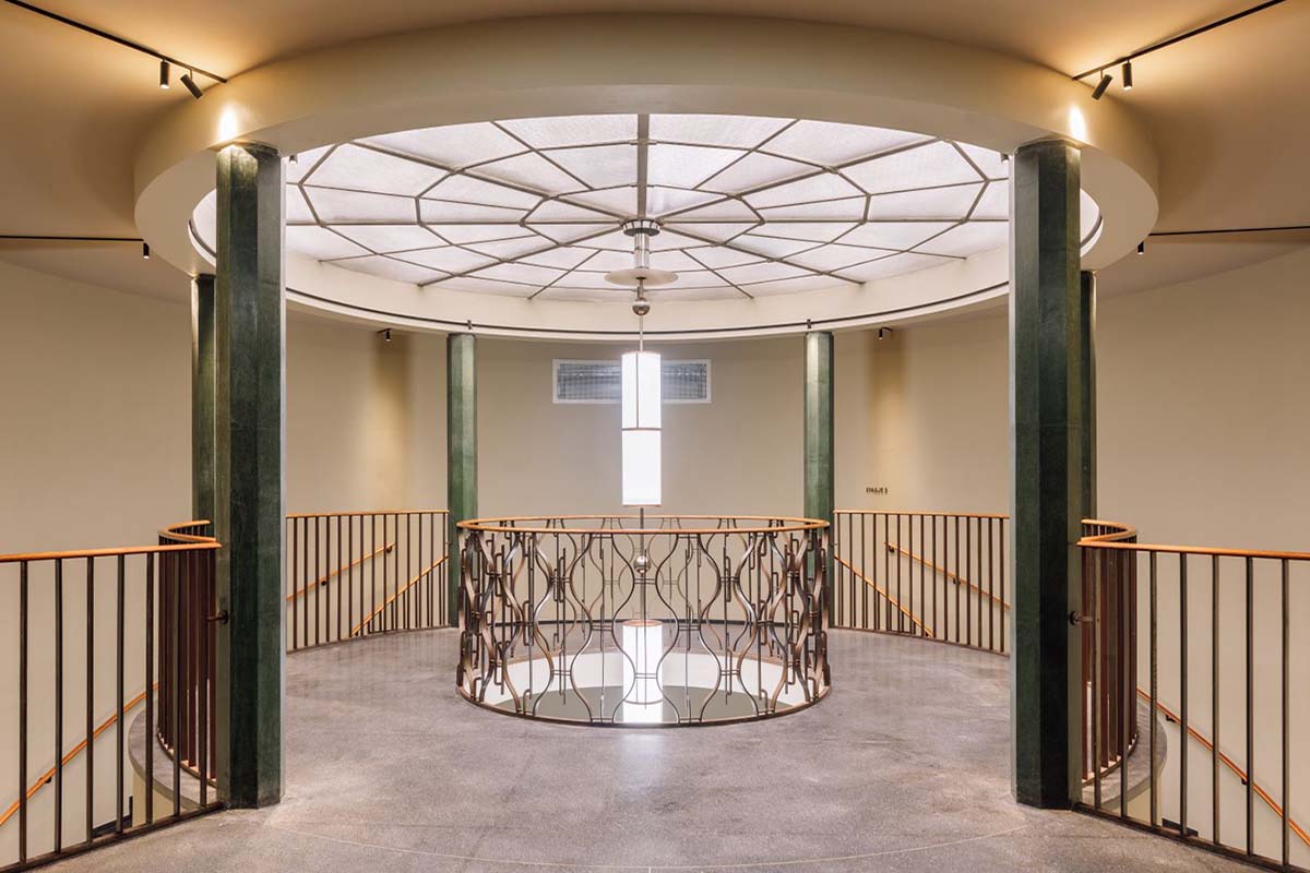 a circular ceiling with a glass railing