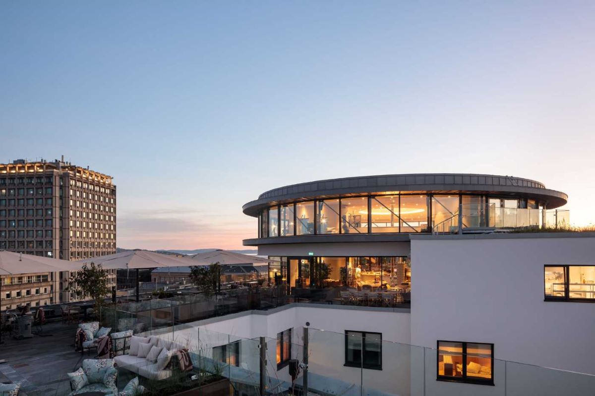 a building with a balcony and a large building