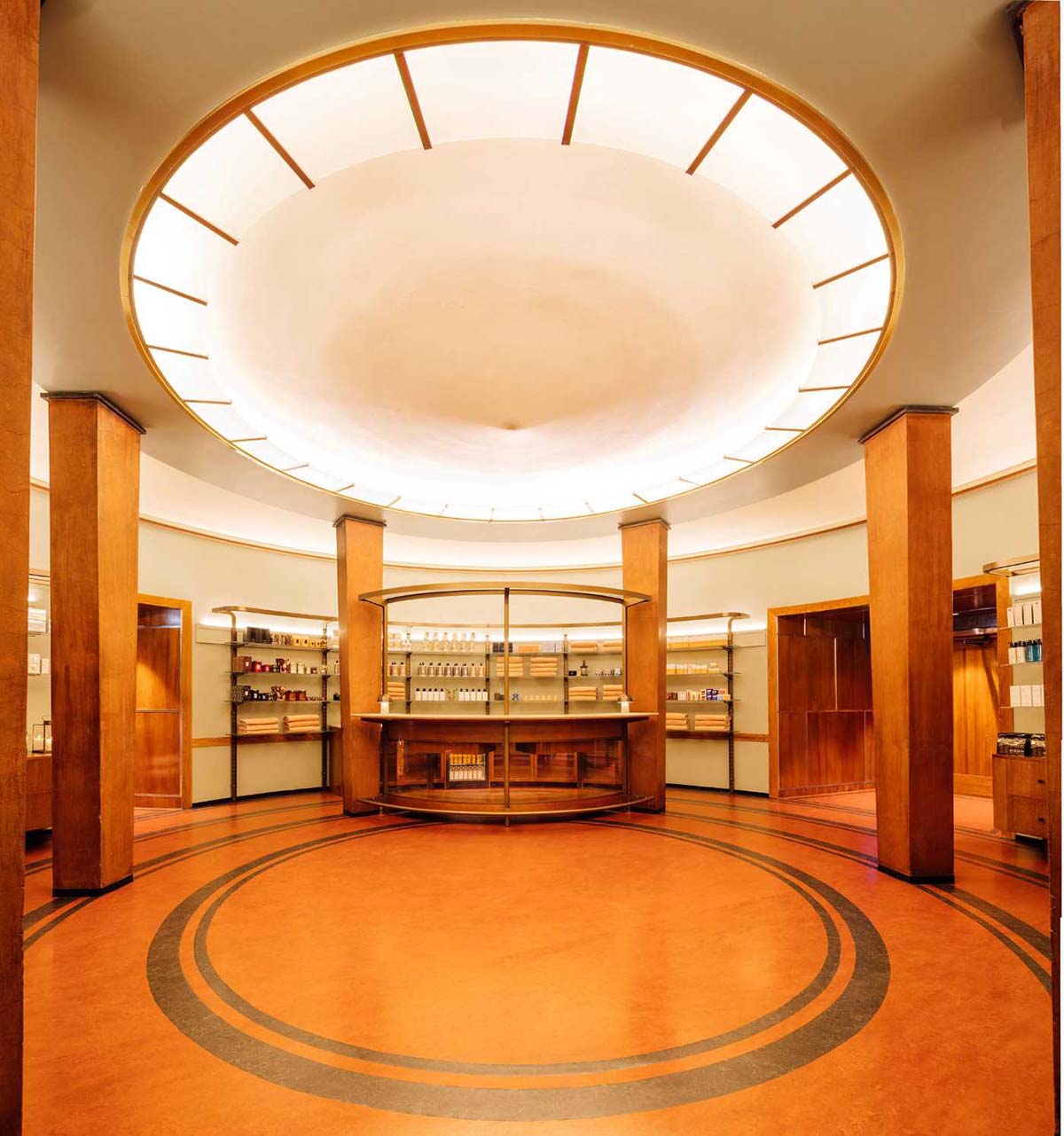 a room with a circular ceiling and shelves