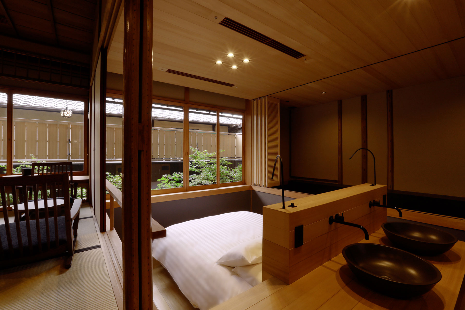 a room with a bed and sink