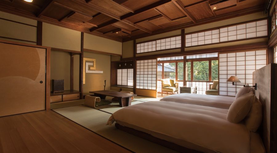a room with two beds and a table