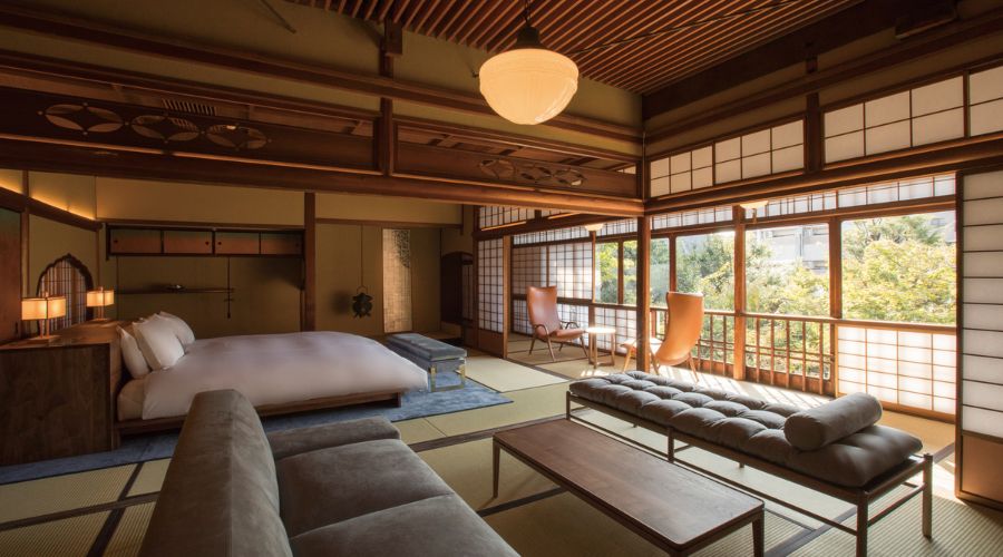 a room with a bed and a bench
