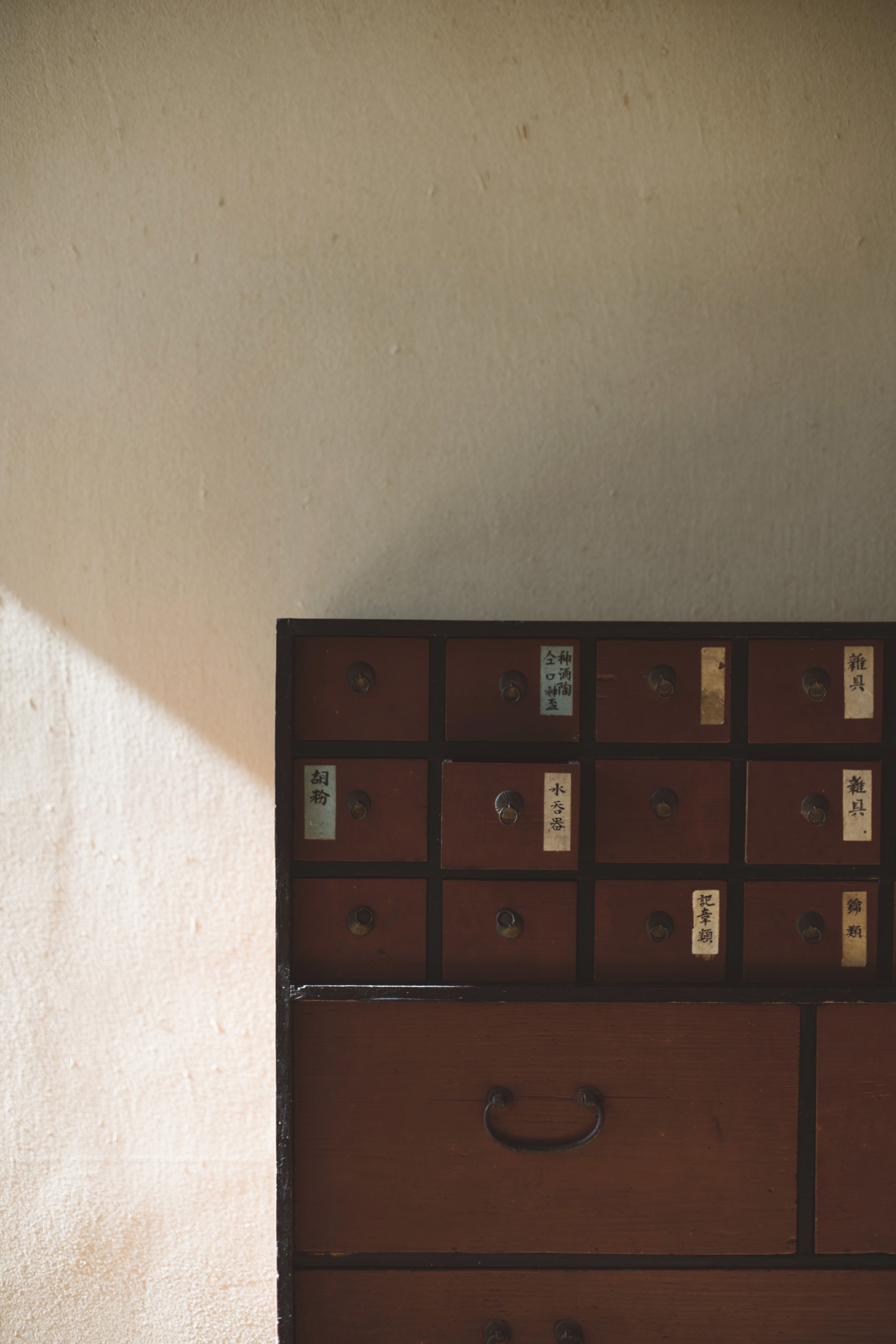 a wooden cabinet with drawers