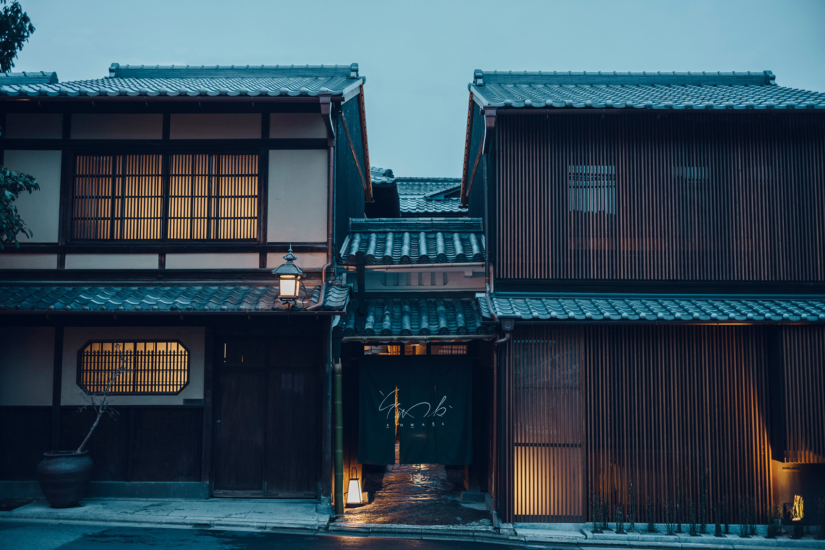 a row of buildings with lights