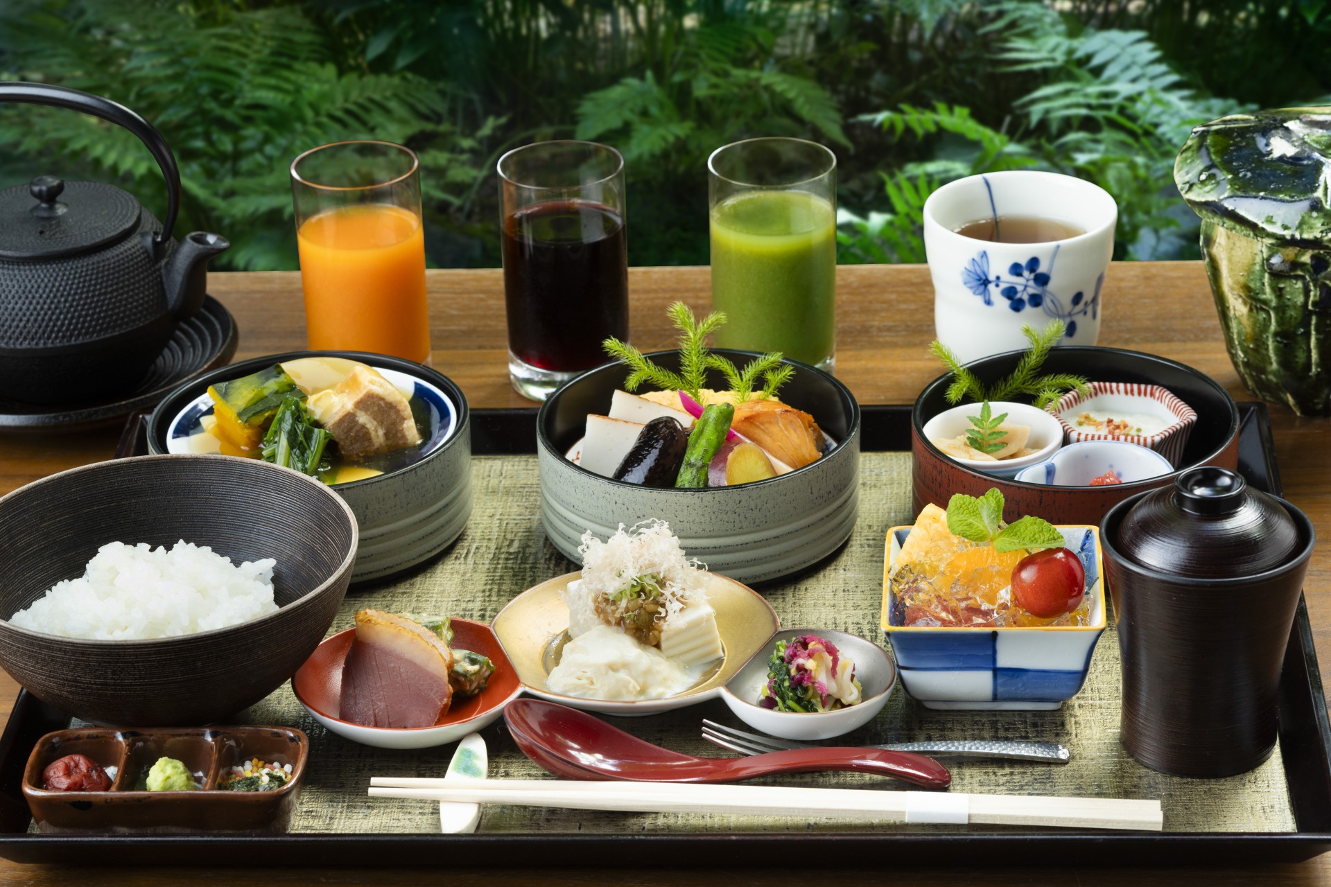 a table with different dishes and drinks