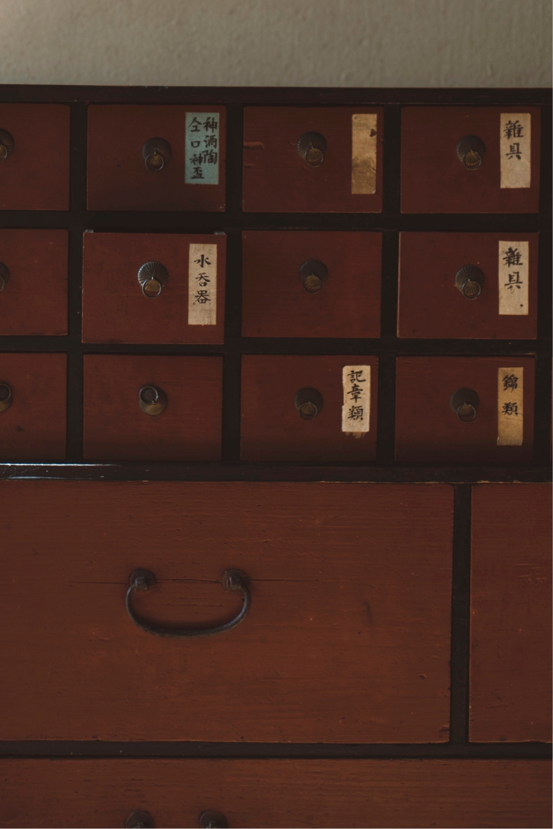 a drawer with many drawers with labels