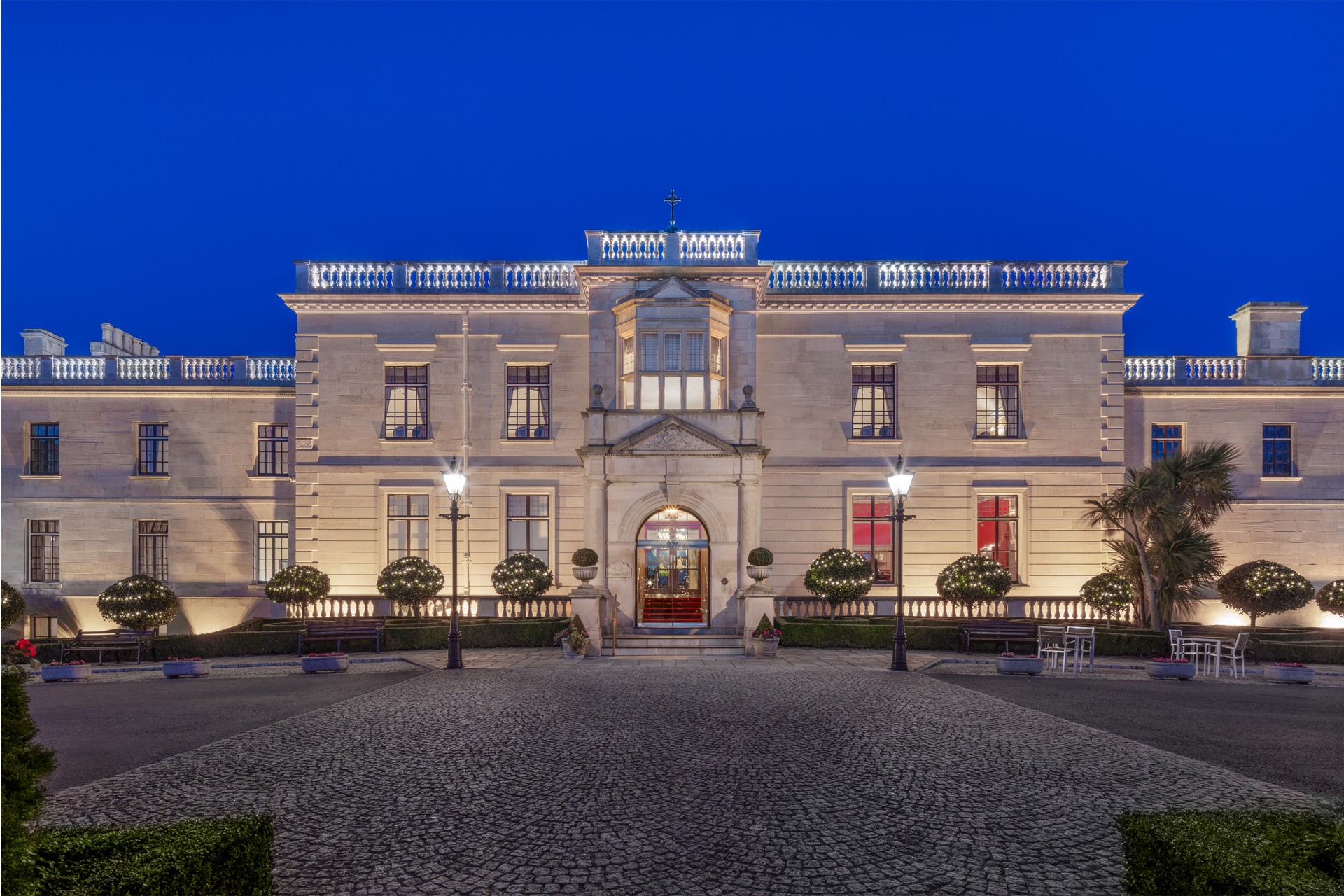 a large white building with lights on