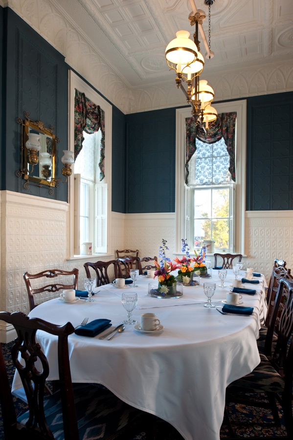 a dining room with a table set