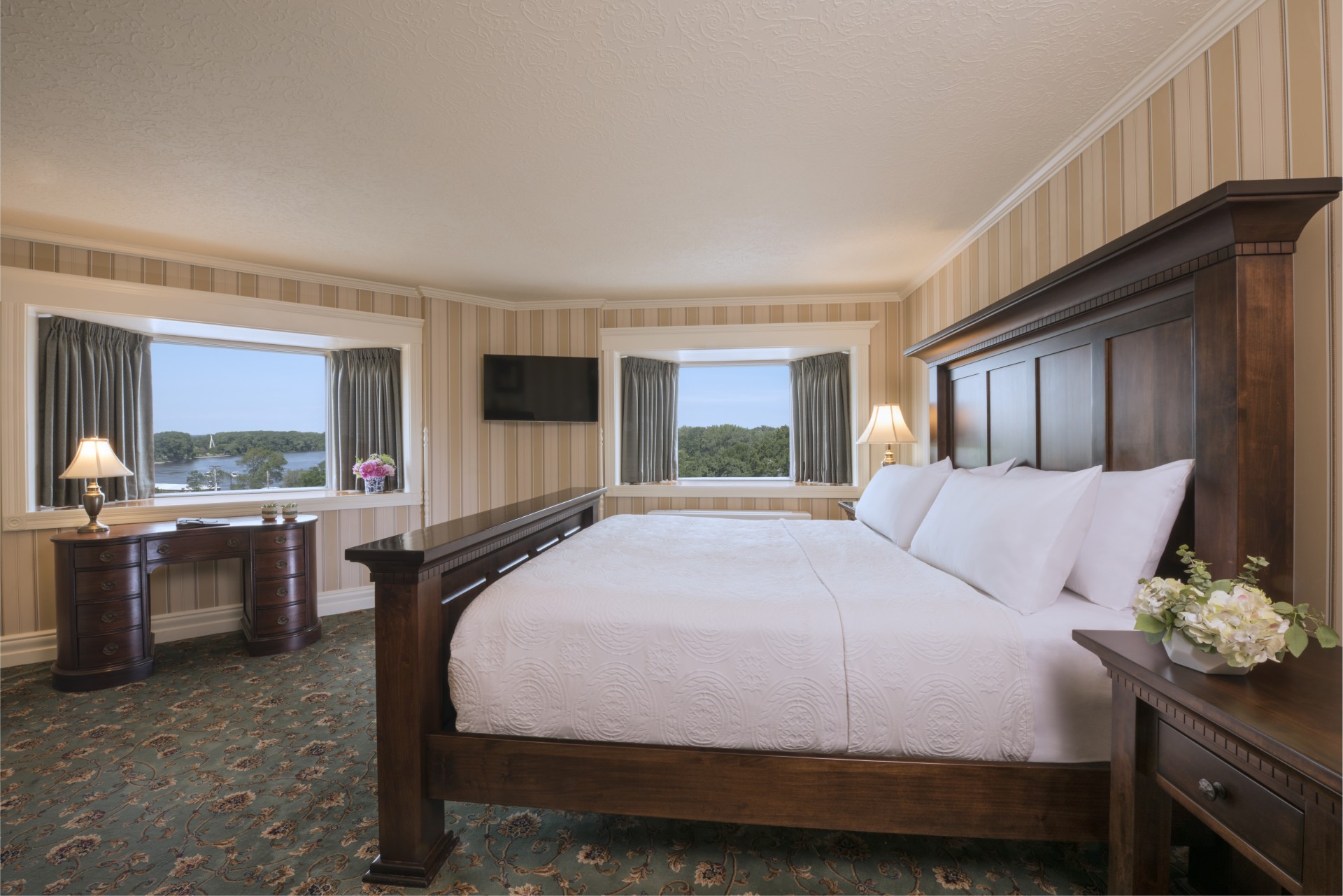 a room with a bed and a dresser
