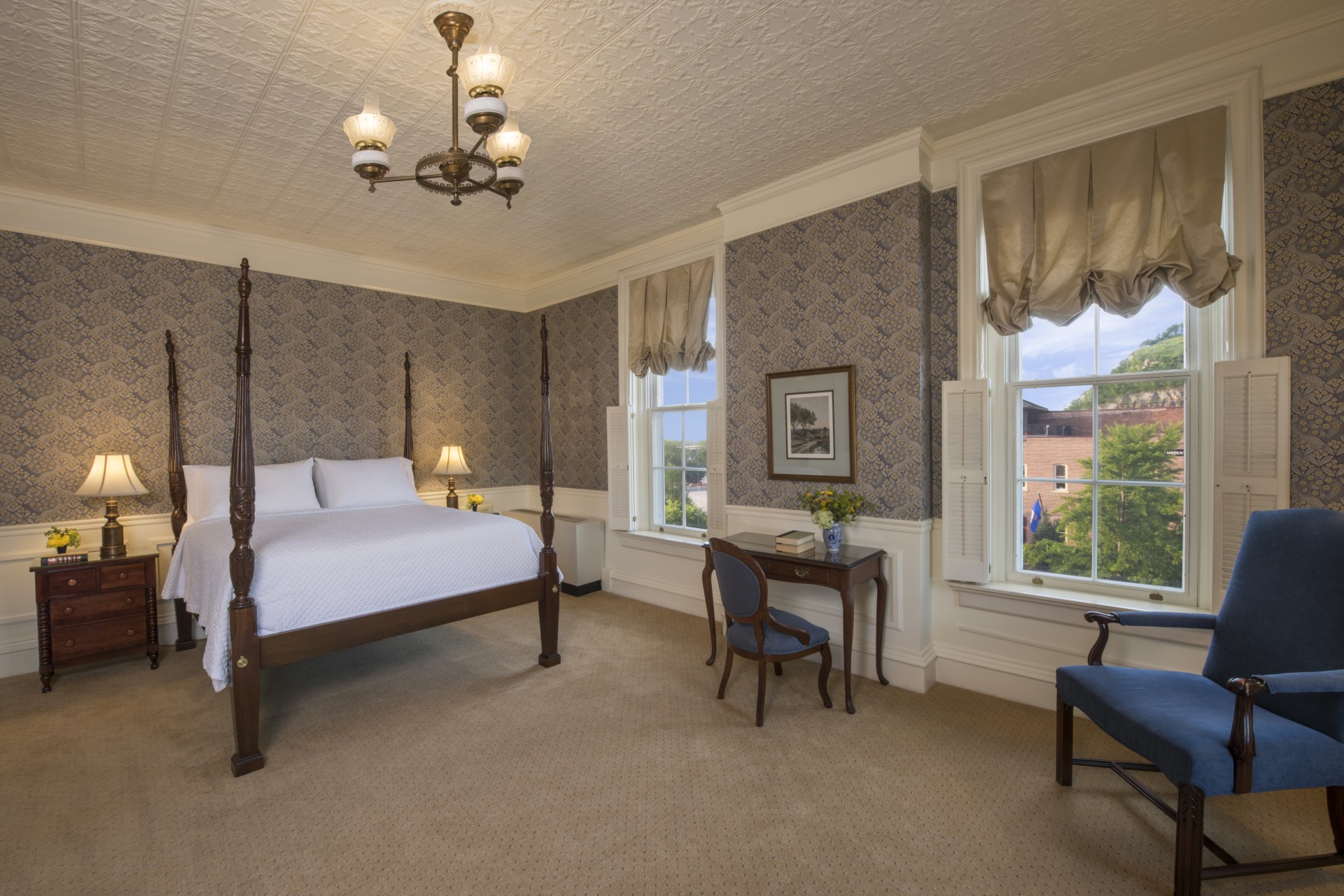 a bedroom with a bed and a chair