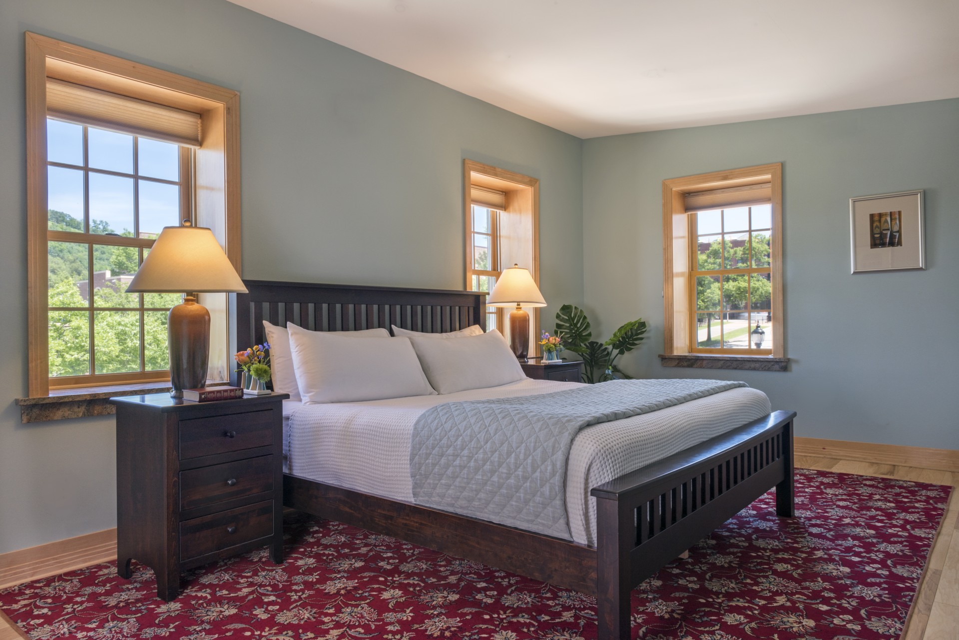 a bedroom with a bed and a table
