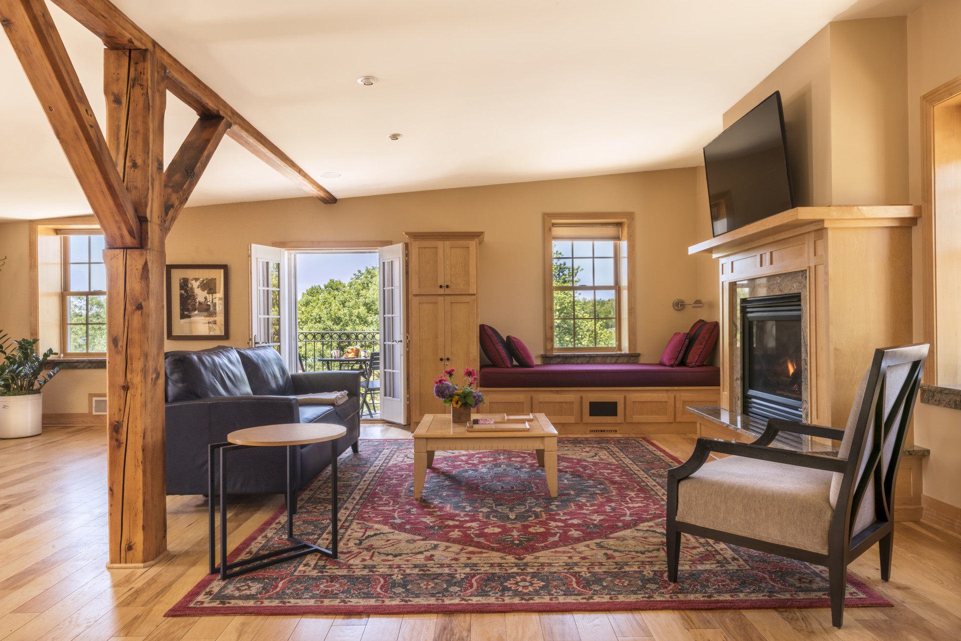 a living room with a fireplace and couches