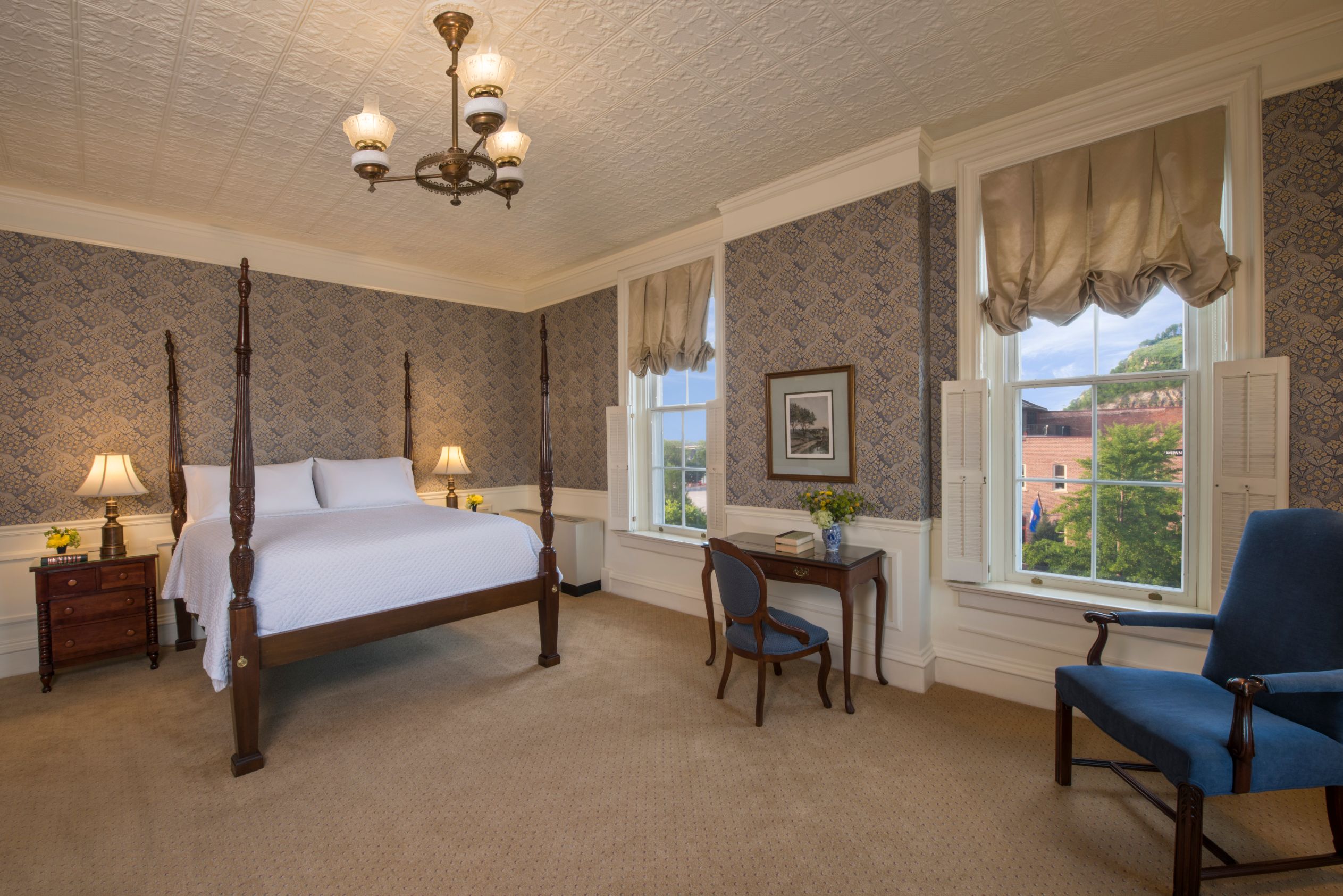 a bedroom with a bed and a chair