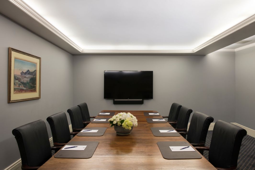 a room with a table and chairs