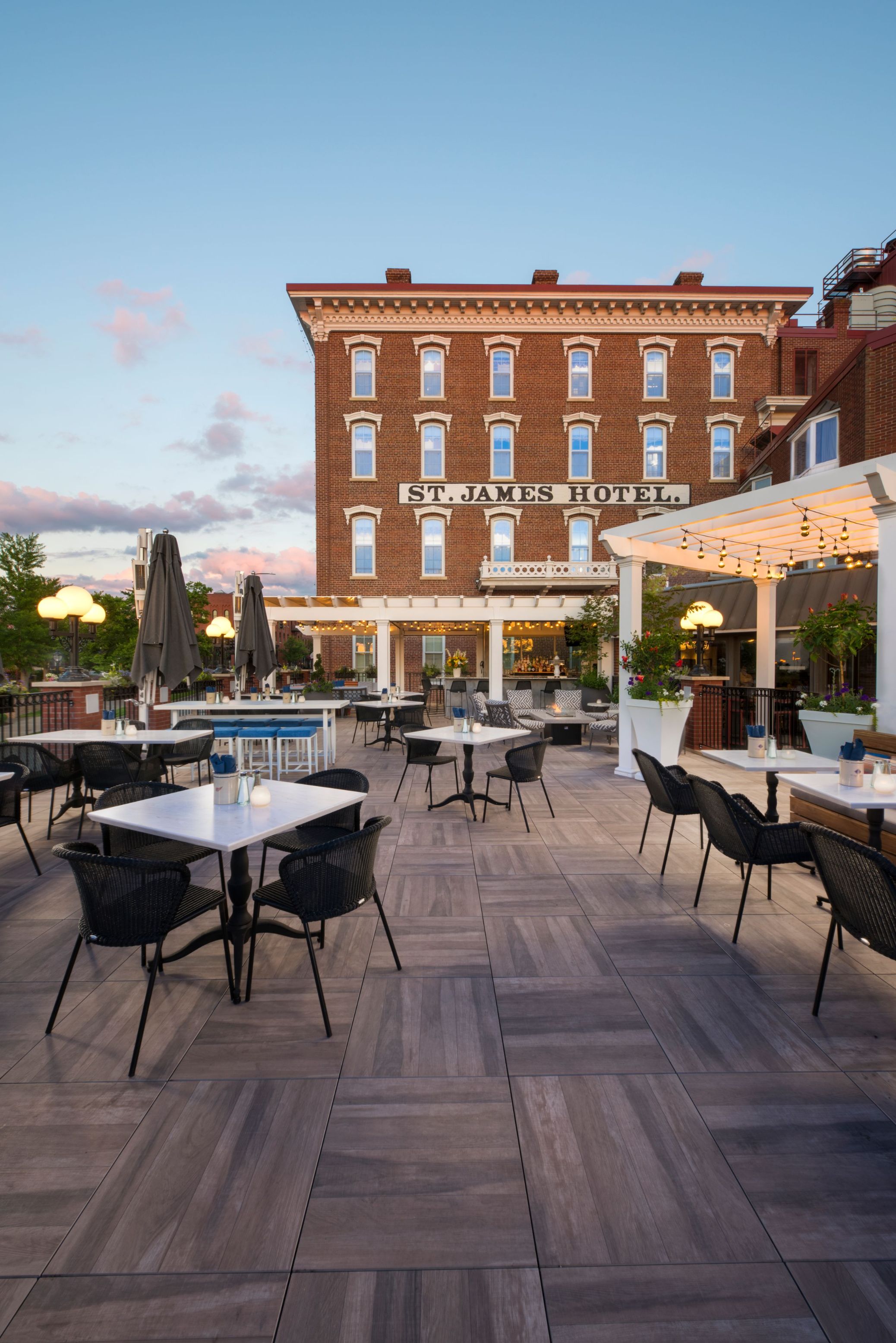 a restaurant with tables and chairs outside