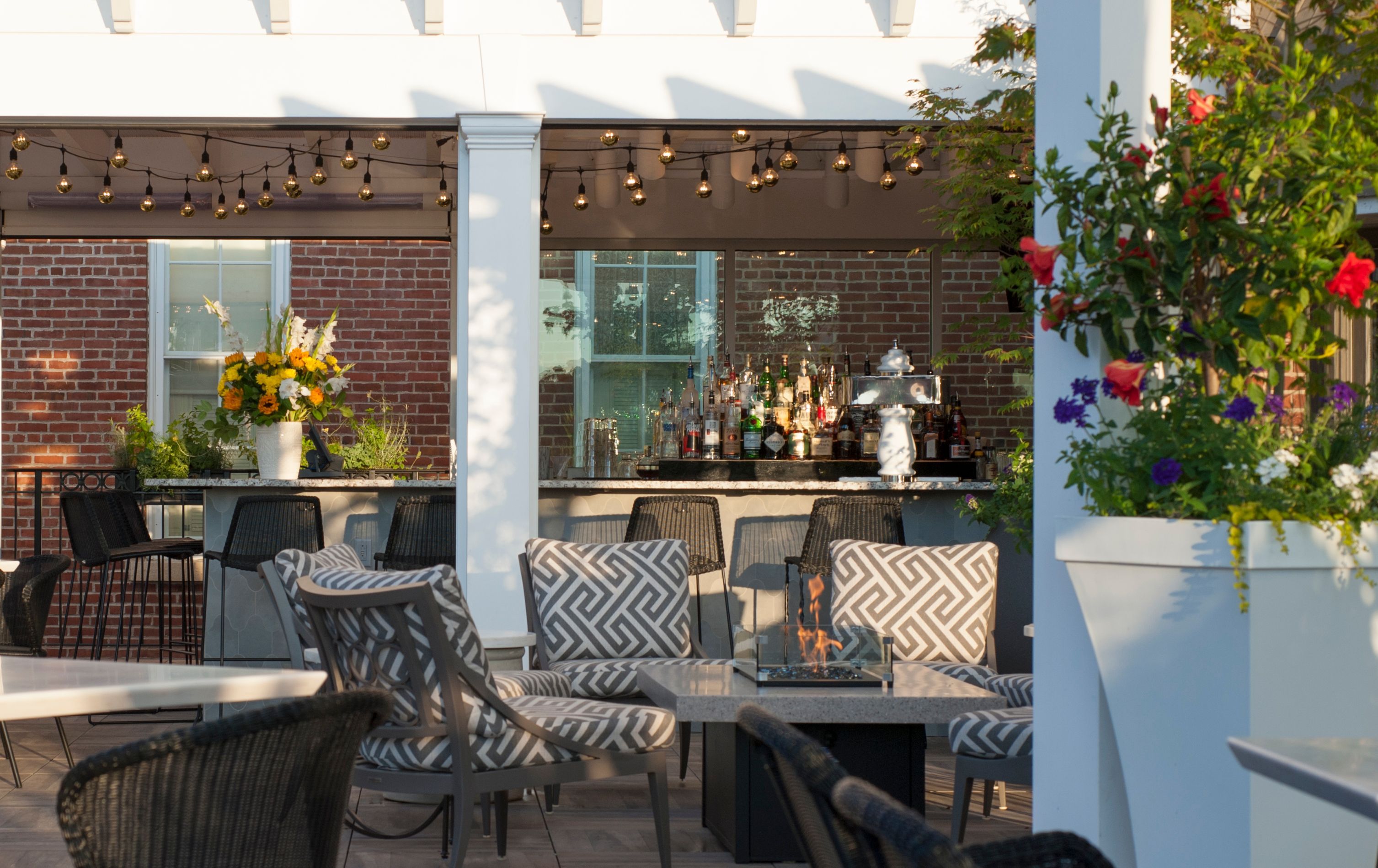 a patio with chairs and tables