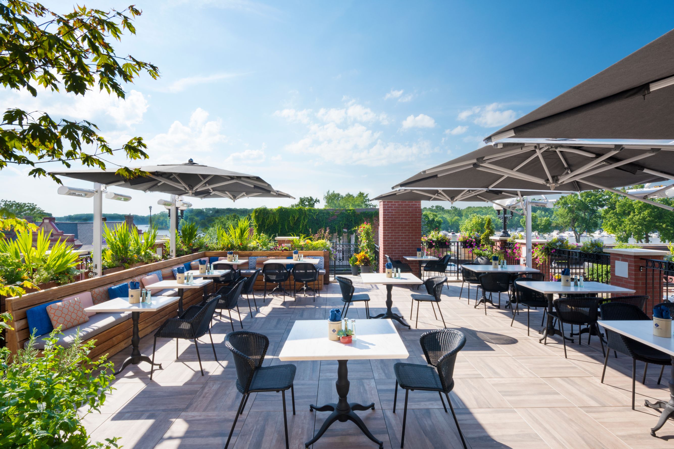 a patio with tables and chairs