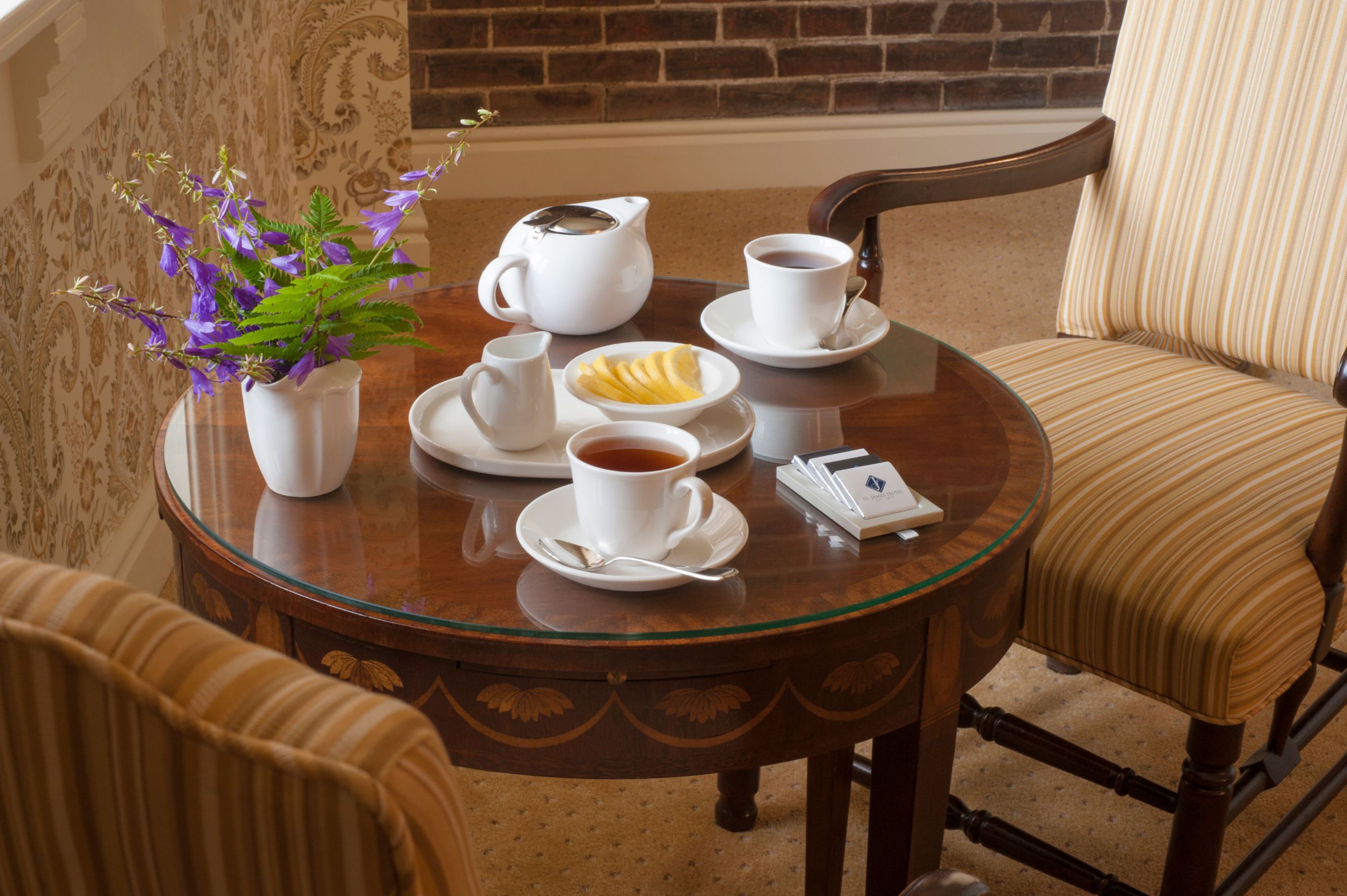 a table with tea cups and saucers