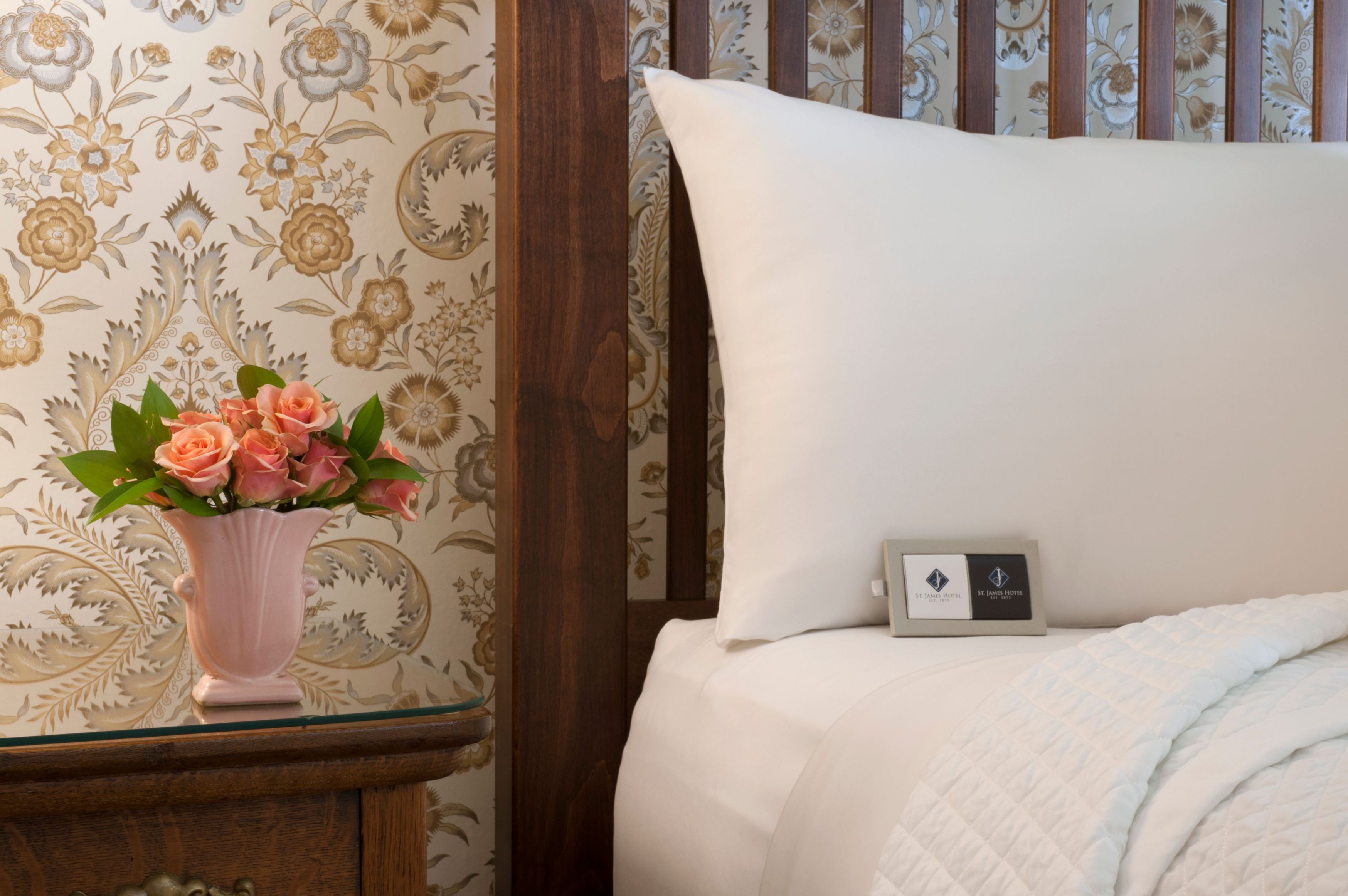 a white pillow on a bed