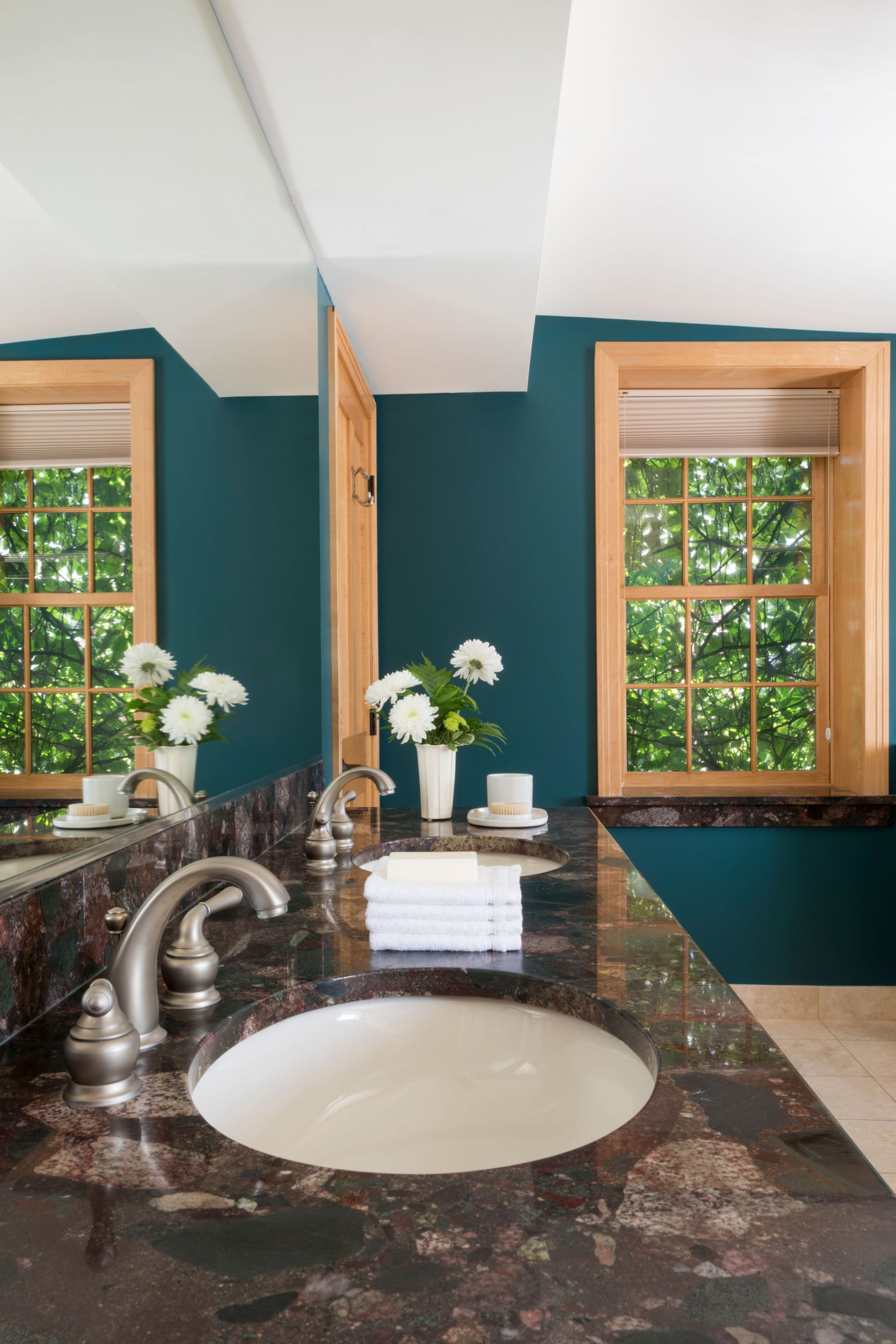 a bathroom with a marble countertop and a marble sink