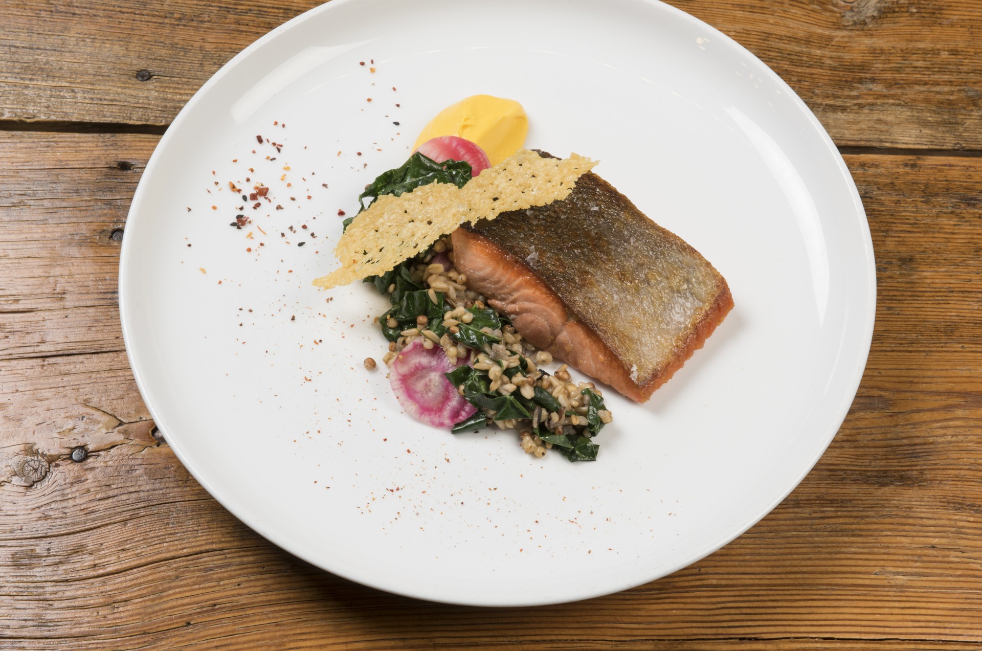 a plate of food on a wood table