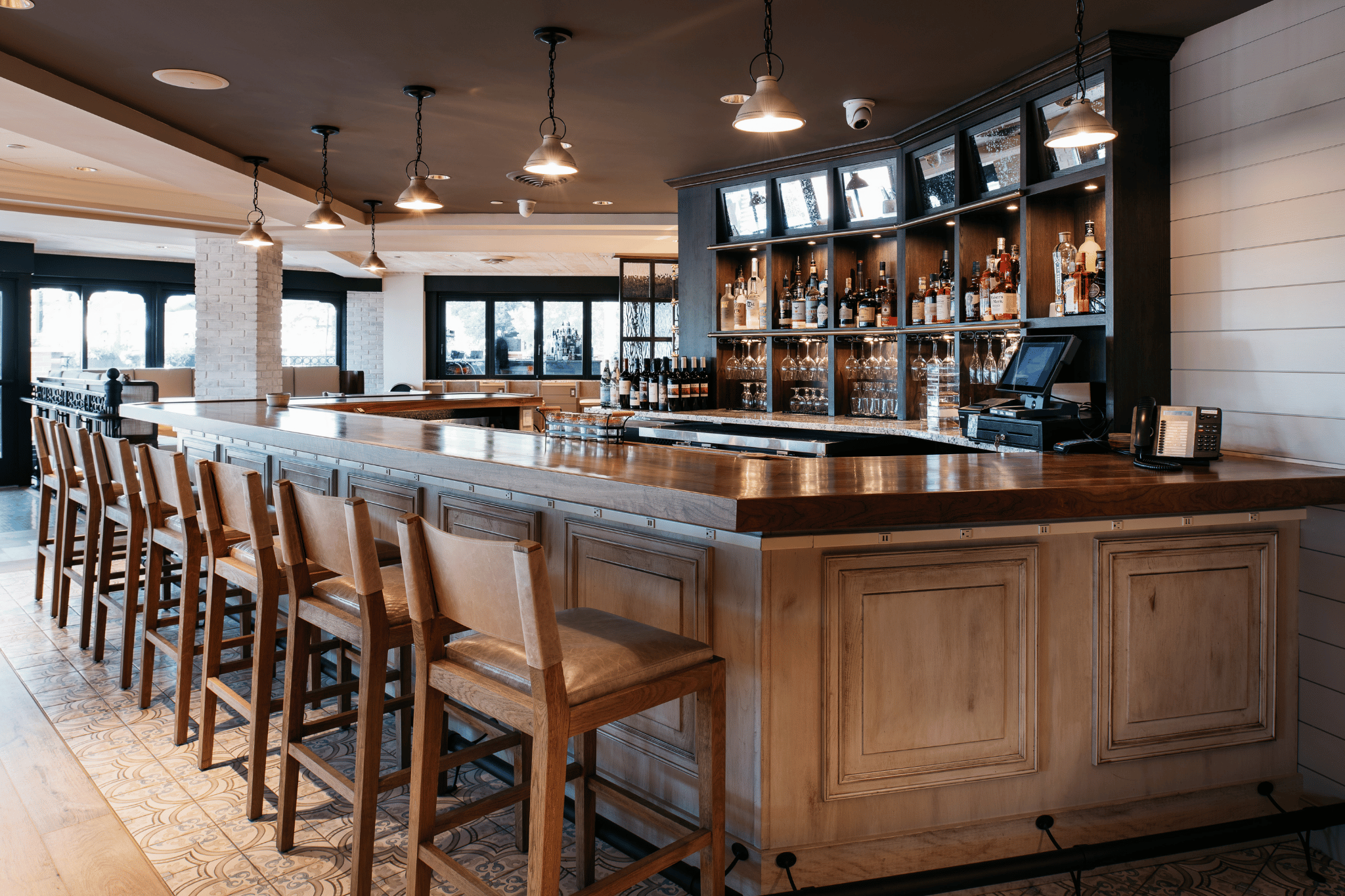 a bar with a counter and chairs