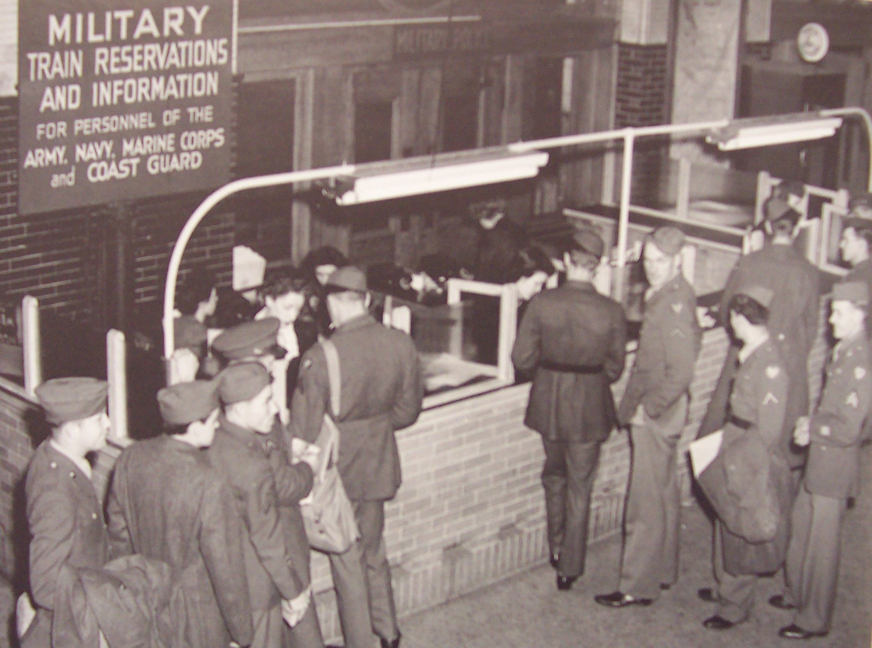 a group of people standing in front of a window
