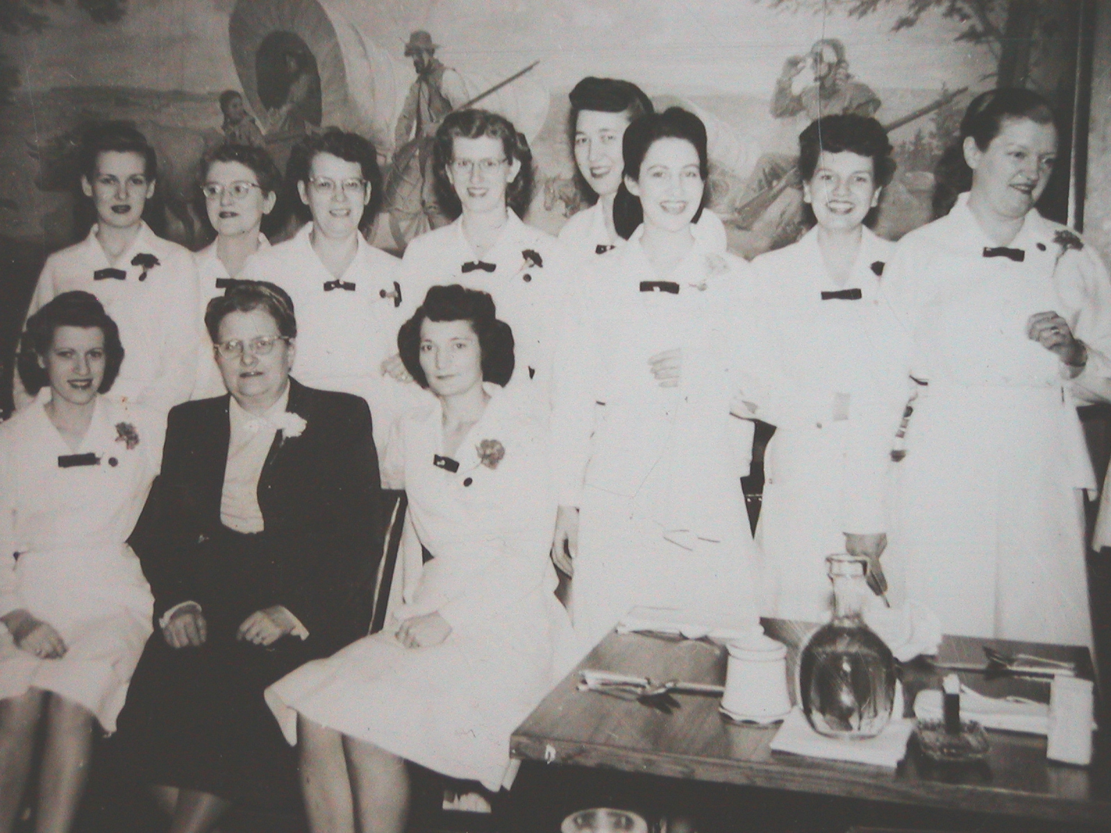 a group of women in white uniforms