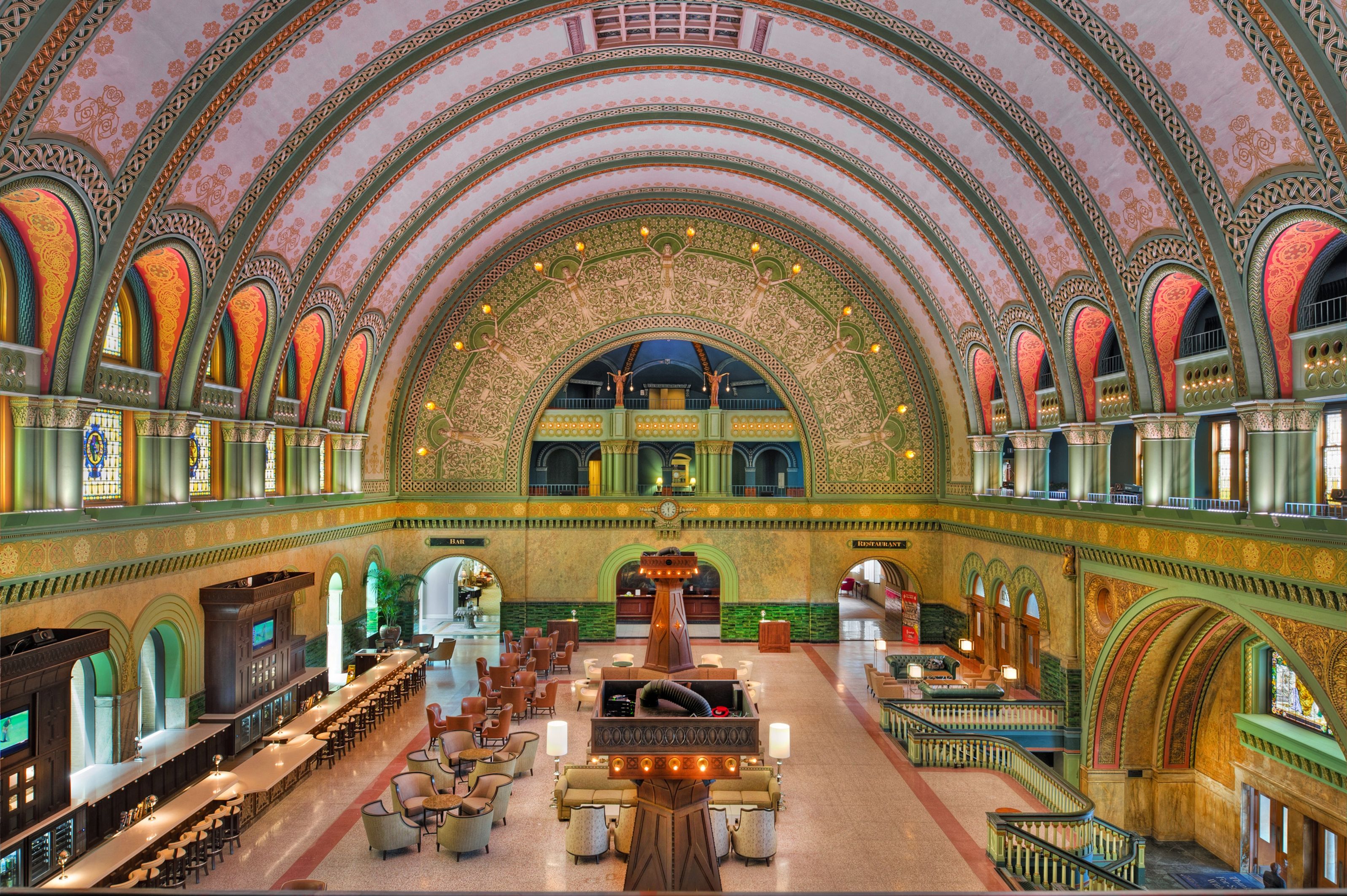 a large ornate building with tables and chairs
