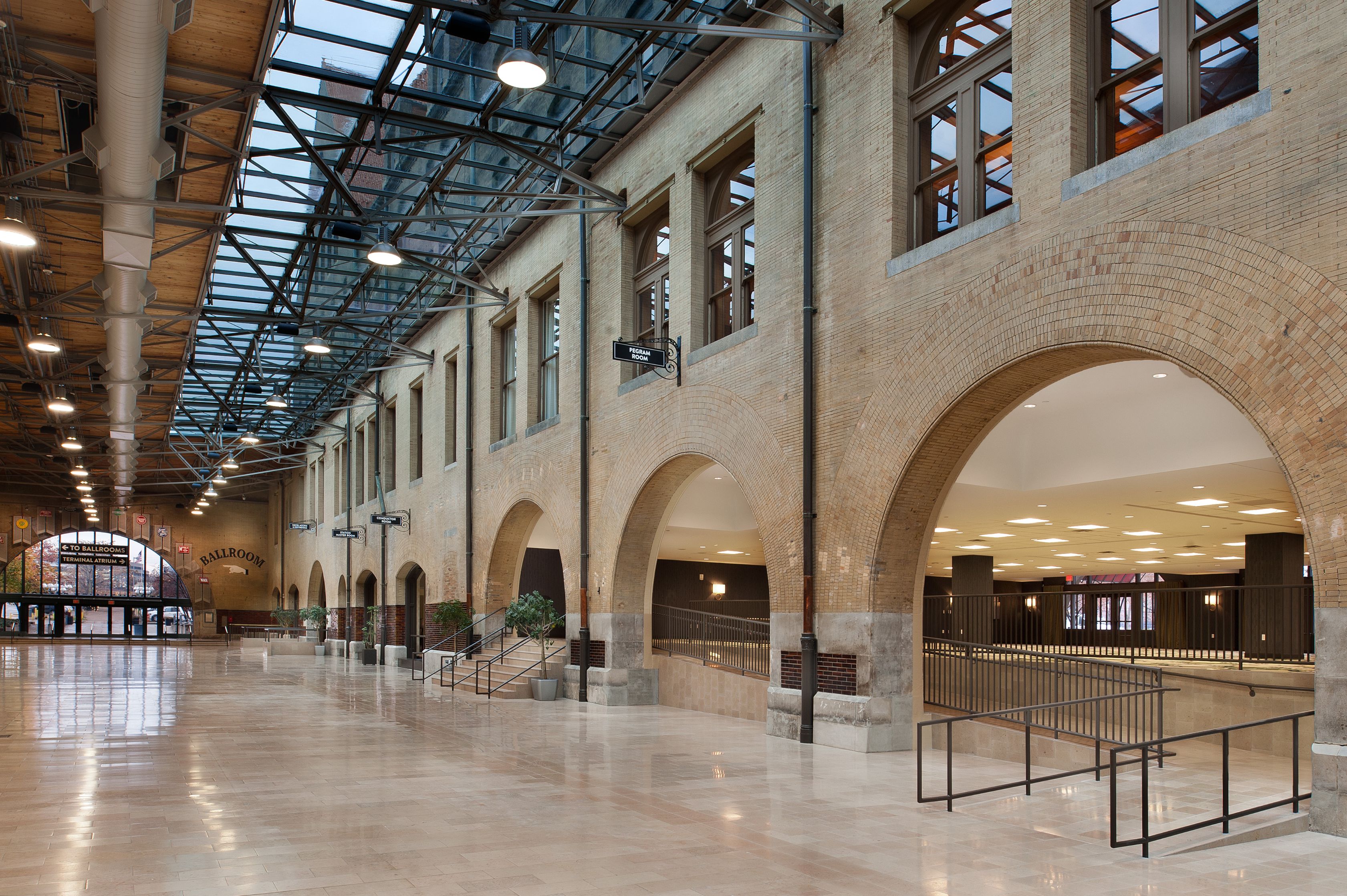 a large brick building with a glass roof