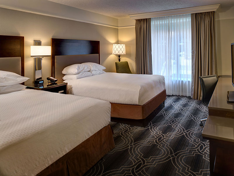 a hotel room with two beds