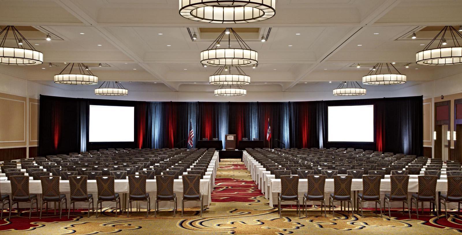 a room with chairs and a podium